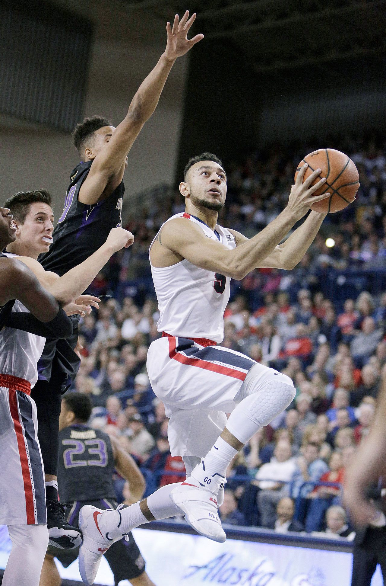 Gonzaga’s Nigel Williams-Goss (right) shoots while defended by Washington’s Markelle Fultz during the first half of the Bulldogs’ 98-71 blowout win over the Huskies on Wednesday night in Spokane. (AP Photo/Young Kwak)