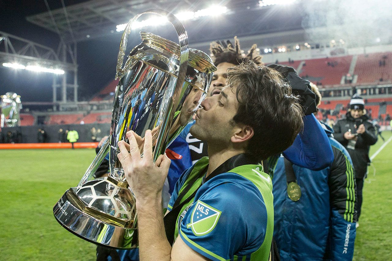 The Sounders’ Nicolas Lodeiro kisses the trophy after his team beat Toronto FC in the MLS Cup final on Saturday in Toronto. (Chris Young/The Canadian Press via AP)