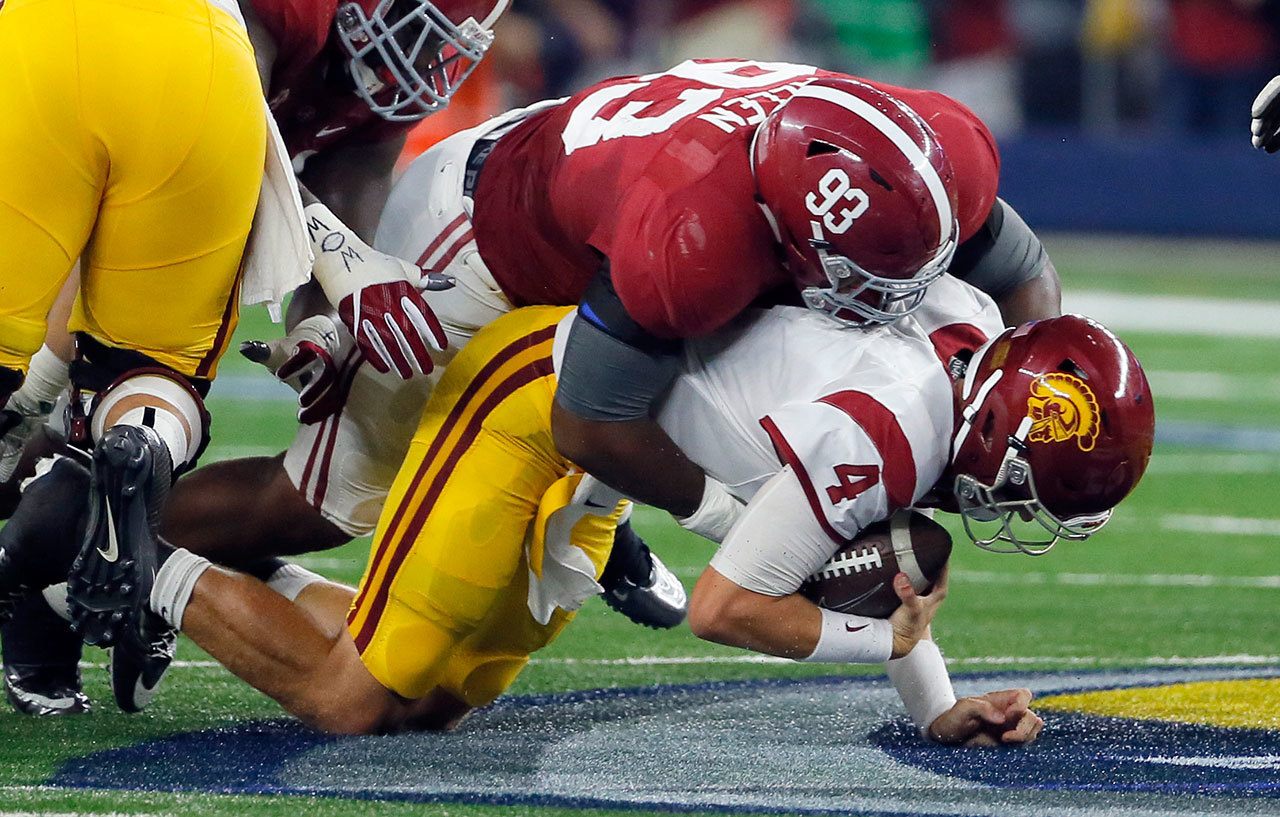 USC quarterback Max Browne (4) is sacked by Alabama defensive lineman Jonathan Allen during a game Sept. 3 in Arlington, Texas. (AP Photo/Tony Gutierrez)