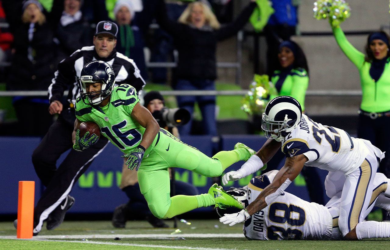 Seahawks wide receiver Tyler Lockett (16) scores a touchdown ahead of Rams cornerback Trumaine Johnson (22) in the second half of a game Thursday in Seattle. (AP Photo/Scott Eklund)