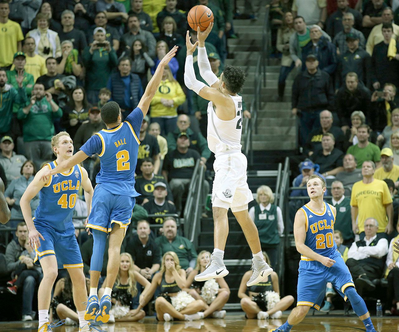 Oregon’s Dillon Brooks (center right) rises up for what would prove to be the game-winning basket as UCLA’s Thomas Welsh (left), Lonzo Ball and Bryce Alford (right) defend on Wednesday as the No. 21 Ducks upset the No. 2 Bruins on Wednesday in Eugene, Ore. (AP Photo/Chris Pietsch)