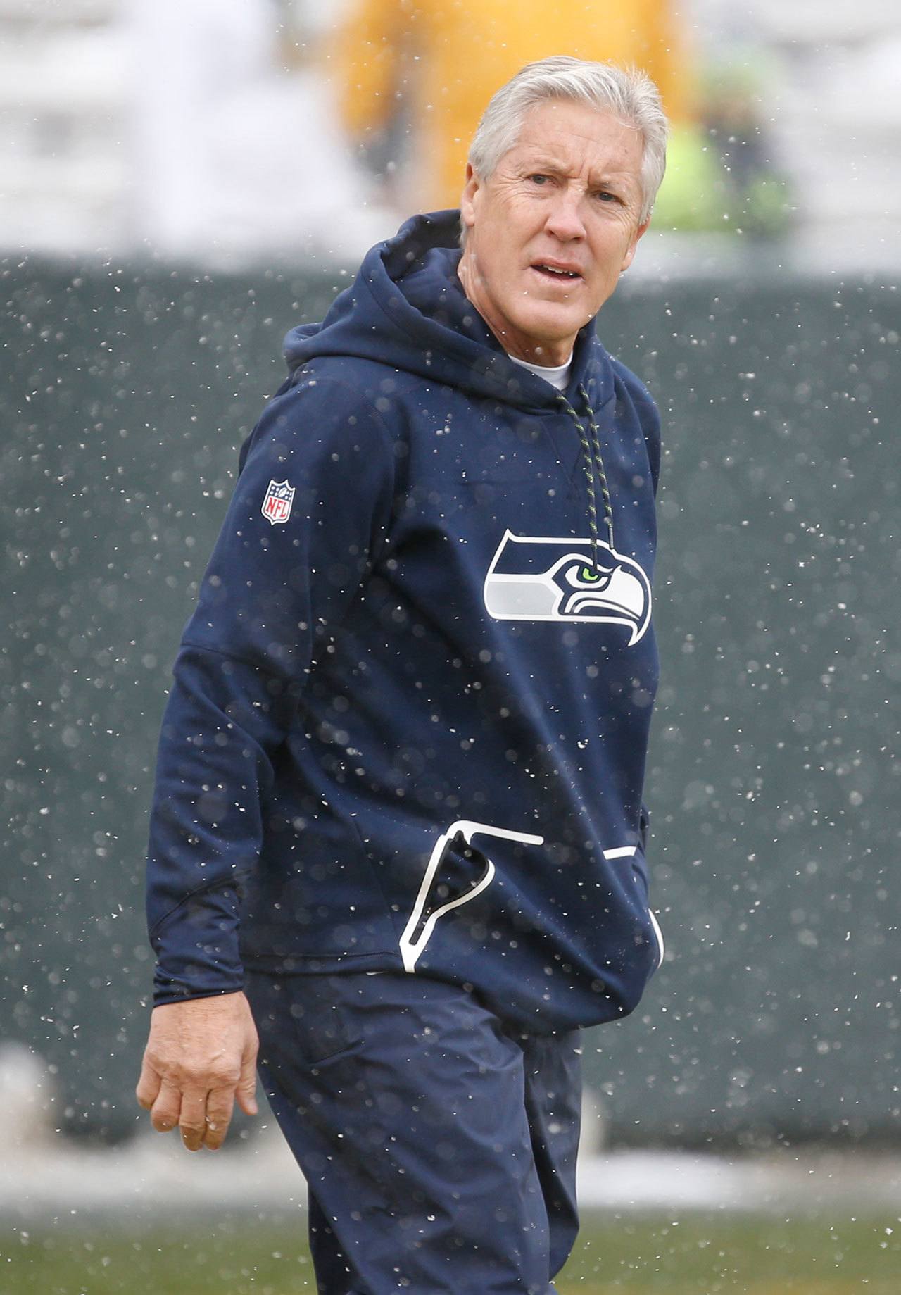 Seattle Seahawks head coach Pete Carroll watches his team warm up before Sunday’s game against the Green Bay Packers. (AP Photo/Mike Roemer)
