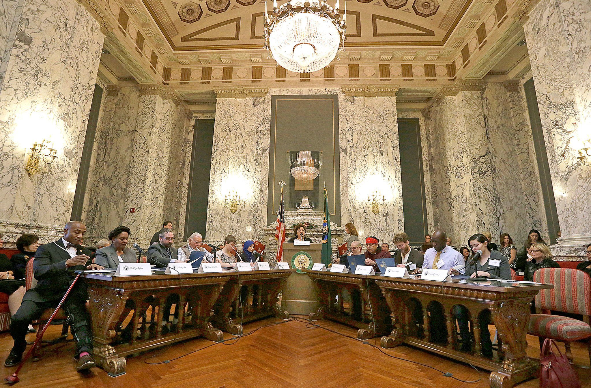 Electors fill out their ballots during a meeting of Washington’s Electoral College members at the Capitol on Monday in Olympia. (AP Photo/Elaine Thompson)
