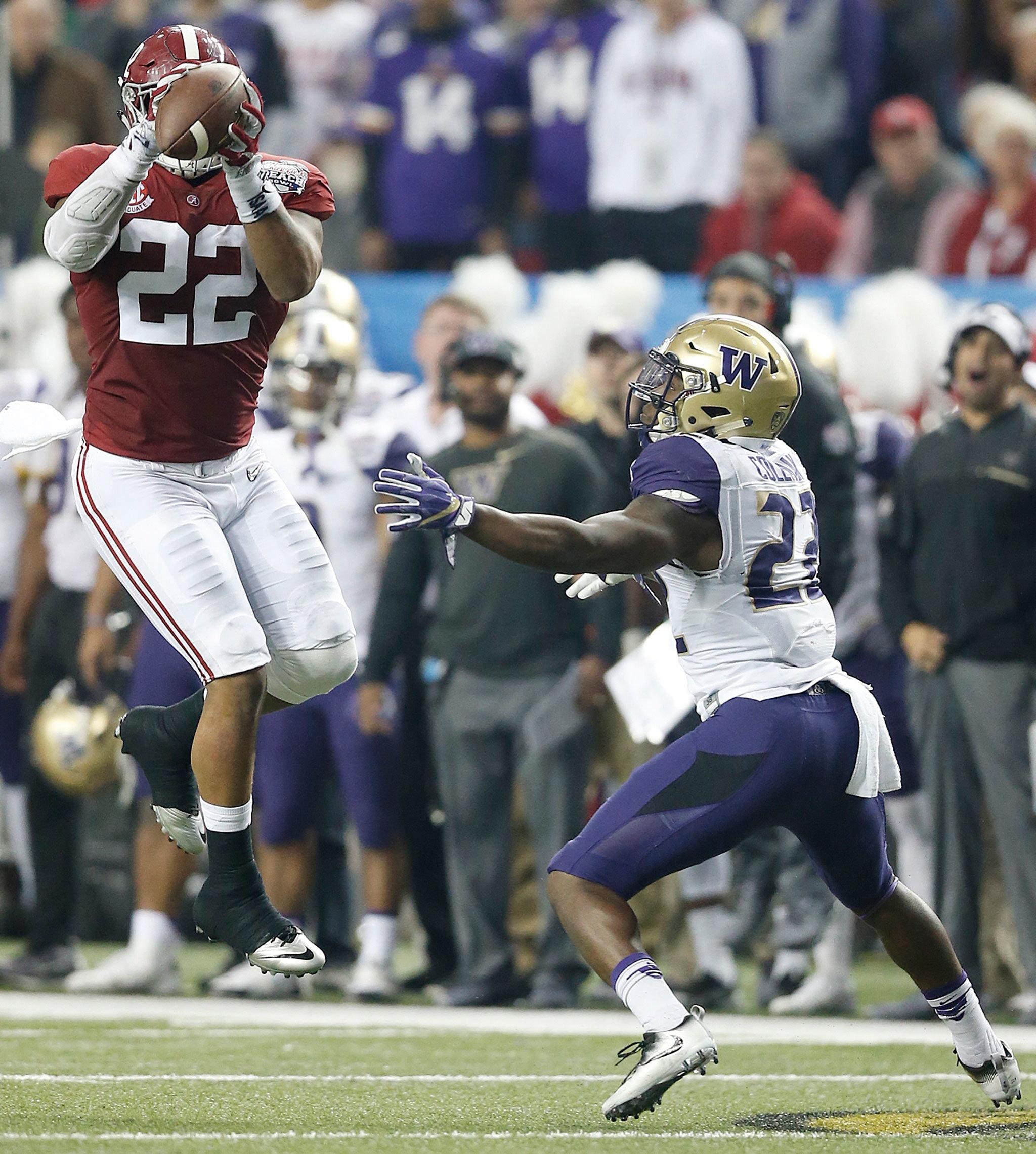 Alabama linebacker Ryan Anderson (22) picks off a pass intended for Washington running back Lavon Coleman (22) during the first half of the Peach Bowl on Saturday in Atlanta. Anderson returned the interception for an Alabama touchdown. (AP Photo/Skip Martin)