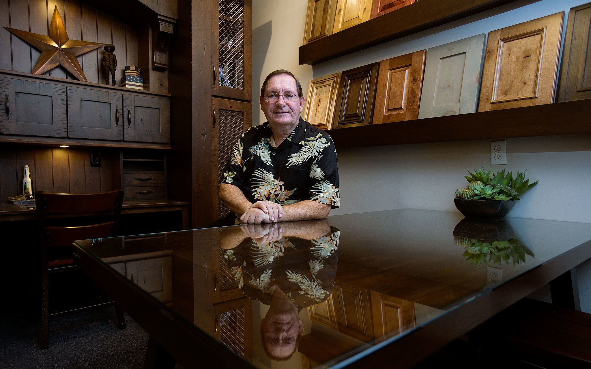 Canyon Creek president and CEO Bill Weaver wears his usual Hawaiian shirt. People wouldn’t recognize him if he didn’t, he said. Weaver is retiring after turning the company around from near bankruptcy to one of Snohomish County’s largest employers. (Andy Bronson / The Herald)