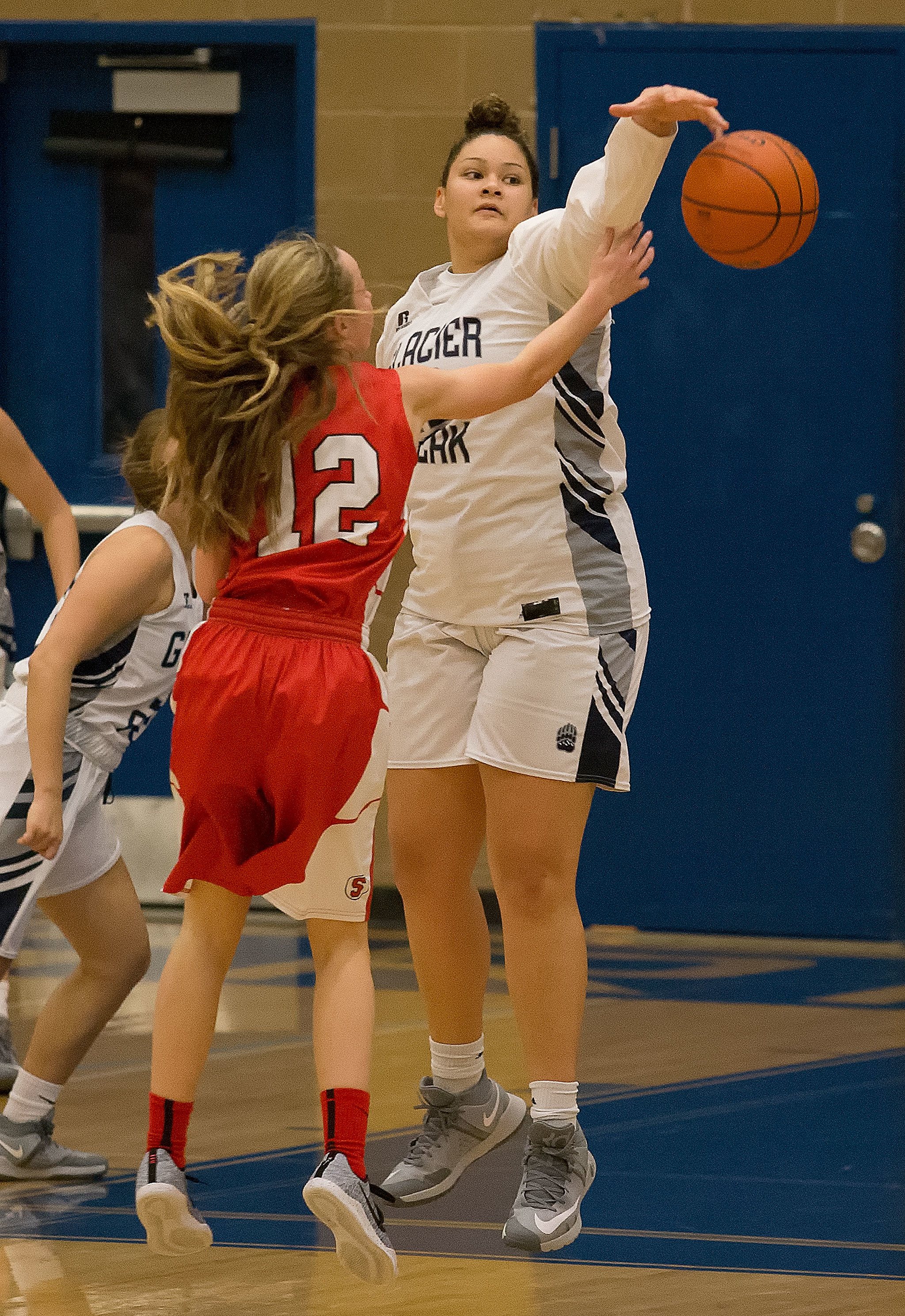 Glacier Peak’s Kayla Watkins (right) blocks a pass by Snohomish’s Maya DuChesne during a game Tuesday night in Snohomish. The Grizzlies beat the Panthers 71-55. (Andy Bronson / The Herald)