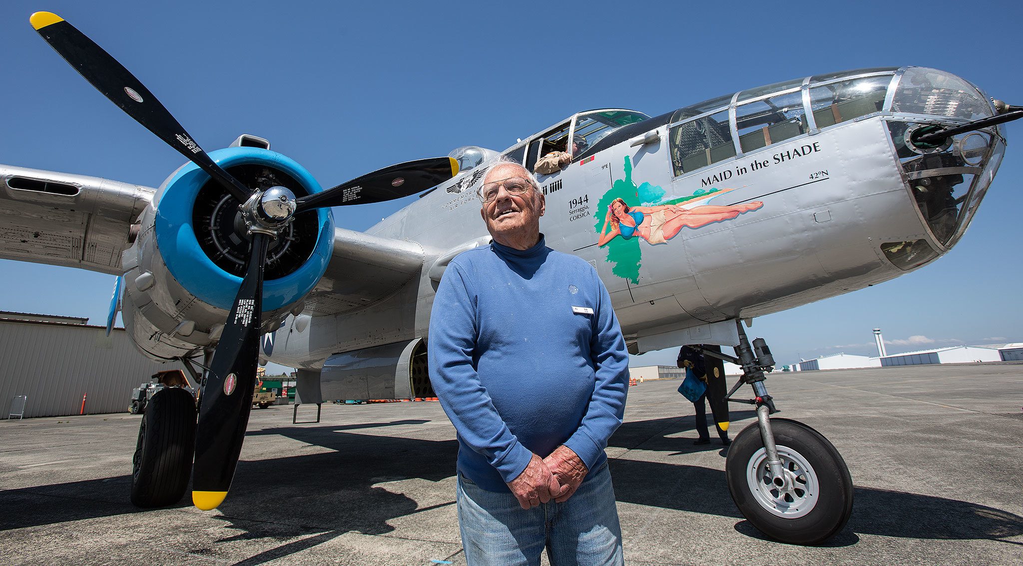 World War II pilot Bob Drew waits to take a ride in Maid in the Shade, a B-25 Mitchell bomber that flew 15 combat missions during World War II, on Aug. 1 outside the Flying Heritage Collection in Everett. Drew’s voice will be part of the audio collection Chronicles of Courage: Stories of Wartime and Innovation available online through the museum. (Andy Bronson / The Herald)