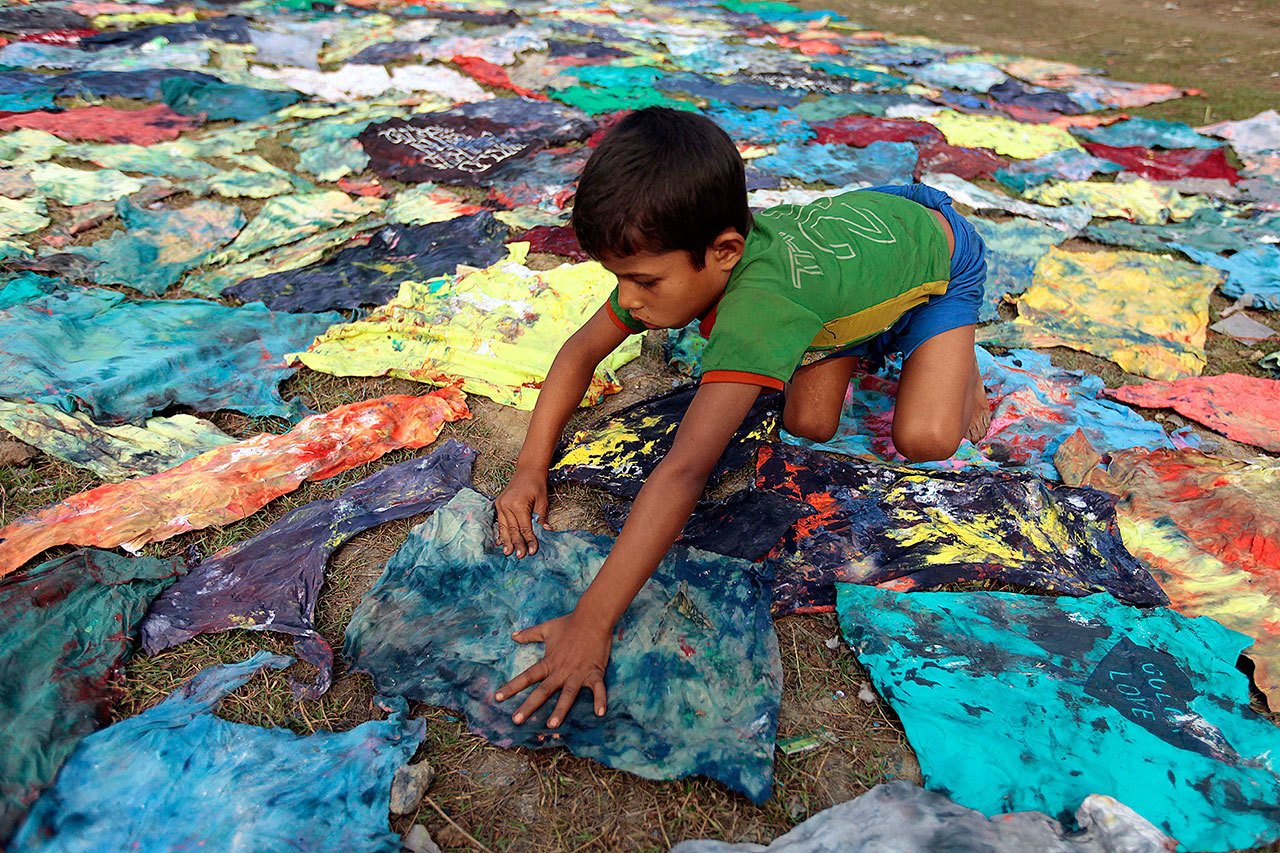 A Bangladeshi child works at a clothes-dyeing factory outside of Dhaka in 2012. (AP Photo/A.M. Ahad)