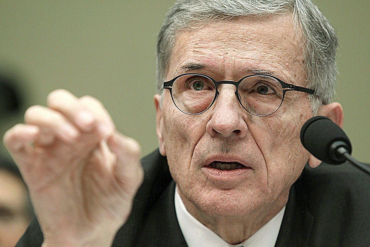 In this 2015 photo, Federal Communications Commission Chairman Tom Wheeler testifies before the House Oversight and Government Reform Committee hearing on net neutrality, on Capitol Hill in Washington. Wheeler says he will step down in January 2017 as President-elect Donald Trump takes office. (AP Photo/Lauren Victoria Burke, File)
