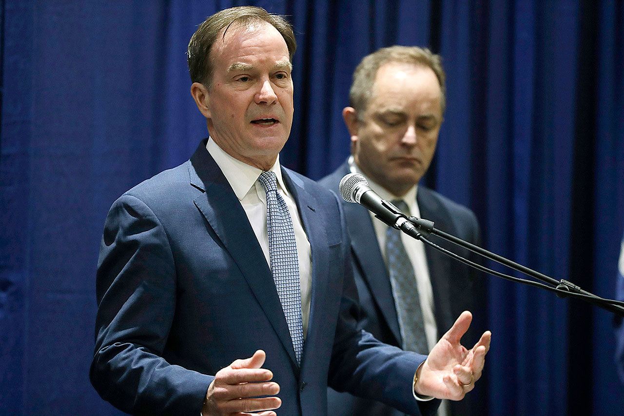 Michigan Attorney General Bill Schuette addresses a news conference Tuesday, Dec. 20, in Flint, Michigan, where he charged two former State of Michigan Emergency Managers, Darnell Earley and Gerald Ambrose, with multiple 20-year felonies for their failure to protect the citizens of Flint from health hazards cased by contaminated drinking water. Schuette also charged Earley, Ambrose and Flint city employees Howard Croft and Daugherty Johnson with felony counts of false pretenses and conspiracy to commit false pretenses in the issuance of bonds to pay for a portion of the water project that led to the crisis. (AP Photo/Carlos Osorio)