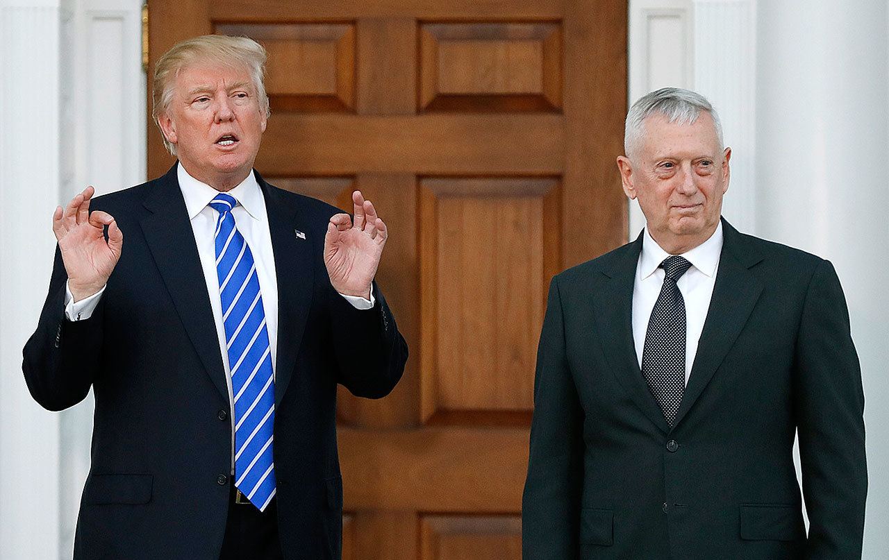 President-elect Donald Trump calls out to media as he stands with retired Marine Corps Gen. James Mattis at Trump National Golf Club Bedminster clubhouse in Bedminster, New Jersey, on Nov. 19. (AP Photo/Carolyn Kaster)