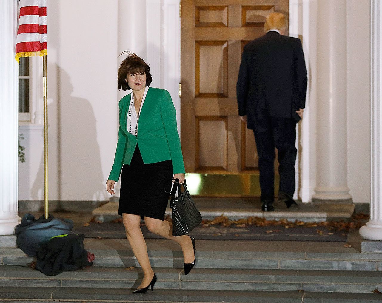 Rep. Cathy McMorris Rodgers, R-Wash., left, leaves as President-elect Donald Trump walks into the Trump National Golf Club Bedminster clubhouse Sunday, Nov. 20, 2016, in Bedminster, N.J.. (AP Photo/Carolyn Kaster)