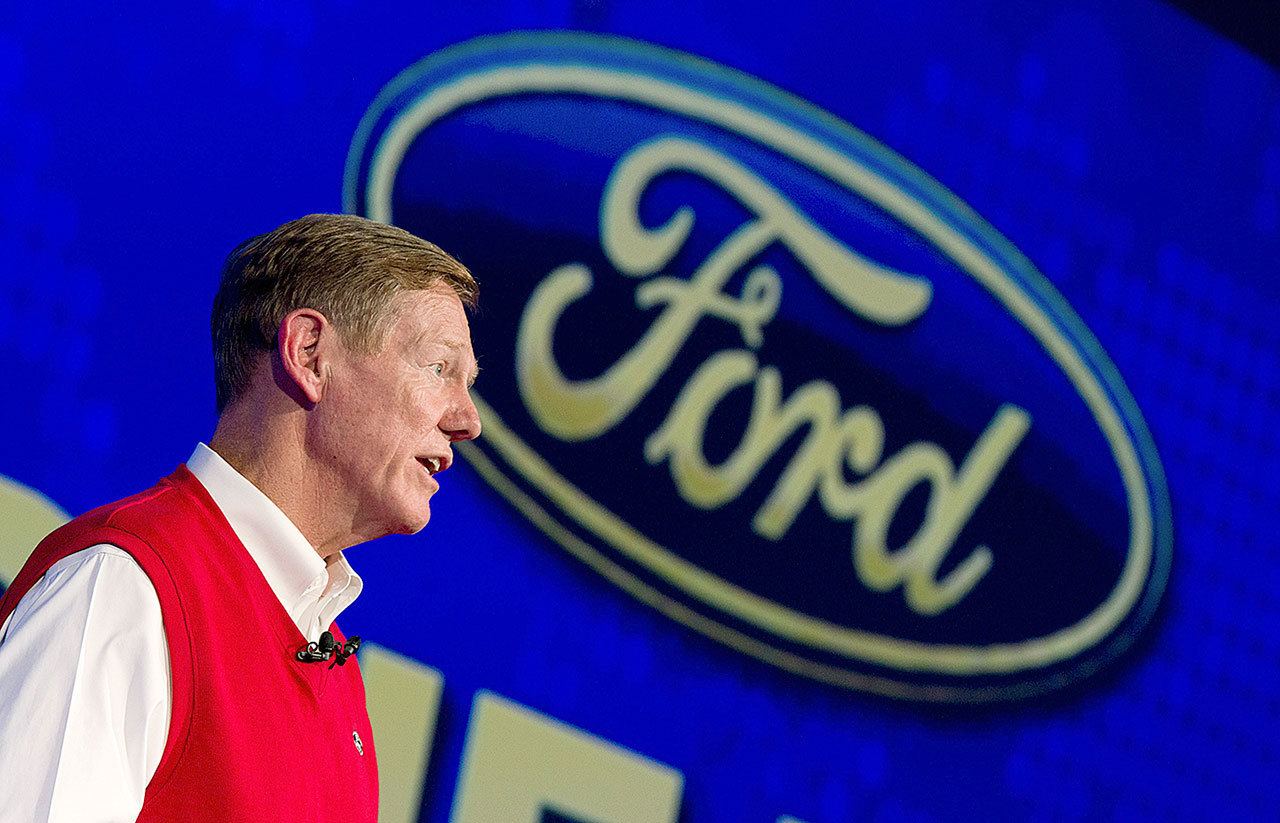 This 2013 photo shows Alan Mulally, former CEO of Ford and former executive with Boeing commercial airplanes, speaking at the IFA, one of the world’s largest trade fairs for consumer electronics and electrical home appliances, in Berlin, Germany. (AP Photo/dpa,Rainer Jensen)