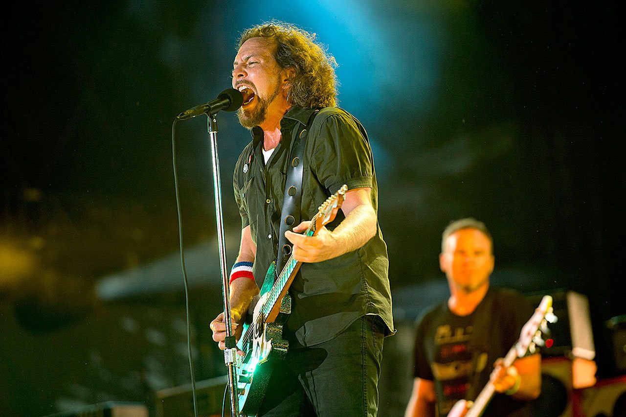 In this 2012 photo, Pearl Jam performs at the “Made In America” music festival in Philadelphia. The Seattle-based rockers and the late rapper Tupac Shakur lead a class of Rock and Roll Hall of Fame inductees that also include folkie Joan Baez and 1970s favorites Journey, Yes and Electric Light Orchestra. The hall’s 32nd annual induction ceremony will take place on April 7, 2016, at Barclays Center in Brooklyn, New York. (Photo by Drew Gurian/Invision/AP, File)