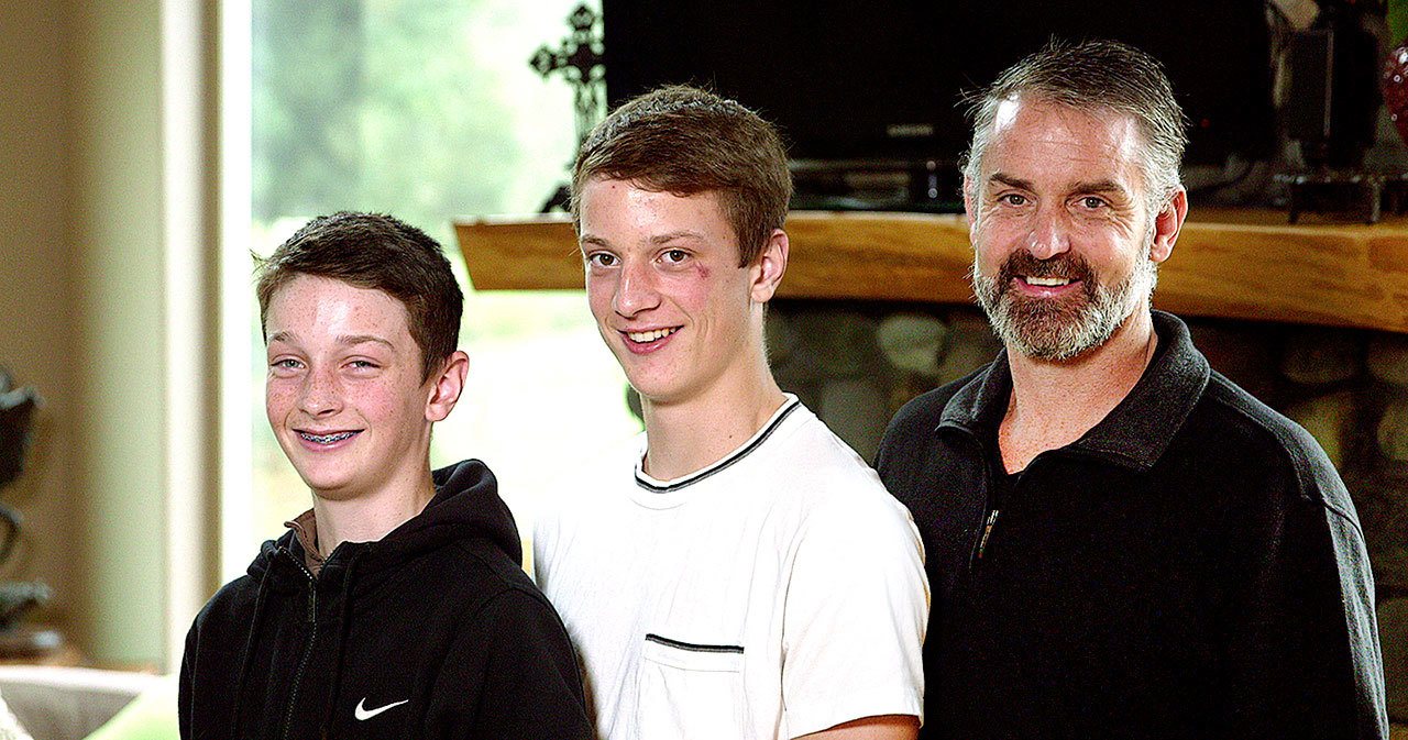 Tom Broselle with sons Thomas (left) and Jake. (Red Cross)