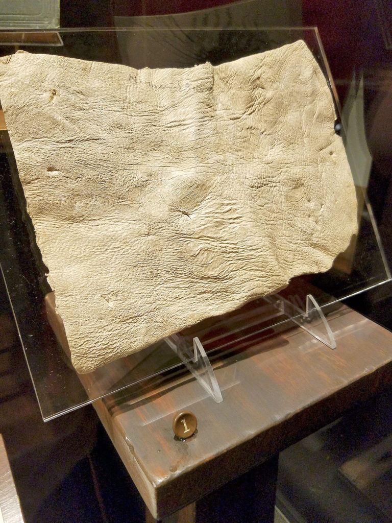 This piece of human skin bears multiple stab and cut wounds, a tool that allowed investigators to study the type of weapon used in the crime. (Christina Okeson / The Herald)
