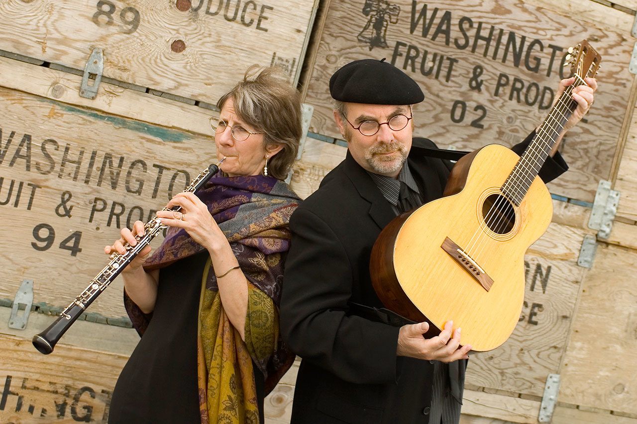 Nancy Rumbel and Eric Tingstad prepare for the Tingstad and Rumbel Twelfth Night Tradition, to be performed Jan. 7 at the Whidbey Island Center for the Arts in Langley.