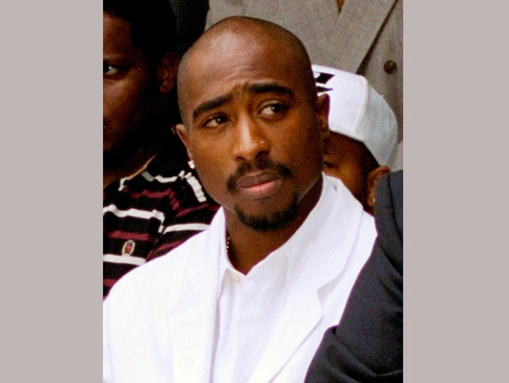 In this 1996 photo, rapper Tupac Shakur attends a voter registration event in South Central Los Angeles. The late rapper is one of the Rock and Roll Hall of Fame inductees. (AP Photo/Frank Wiese, File)
