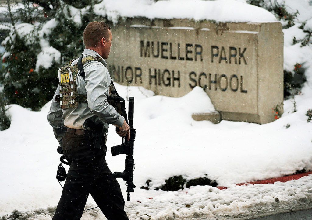 Officials respond to Mueller Park Junior High after a student fired a gun into the ceiling in Bountiful, Utah on Thursday, Dec. 1. (Ravell Call/The Deseret News via AP)
