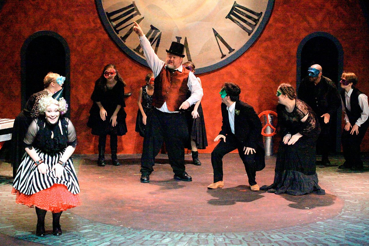 Dale Sutton photo Sydney Kaser as Mrs. Fezziwig, left, and Randy West as Mr. Fezziwig, center, dance the night away in the Edmonds Driftwood Players production of “Mr. Scrooge.”