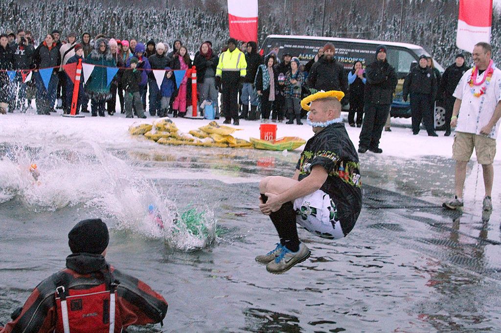 More than a thousand Alaskans took part Saturday in a polar plunge fundraiser at Goose Lake in Anchorage, Alaska. The plunge was a benefit for Special Olympics Alaska, and has raised more than $2 million for the organization in the eight years it has been held. (AP Photo/Mark Thiessen)
