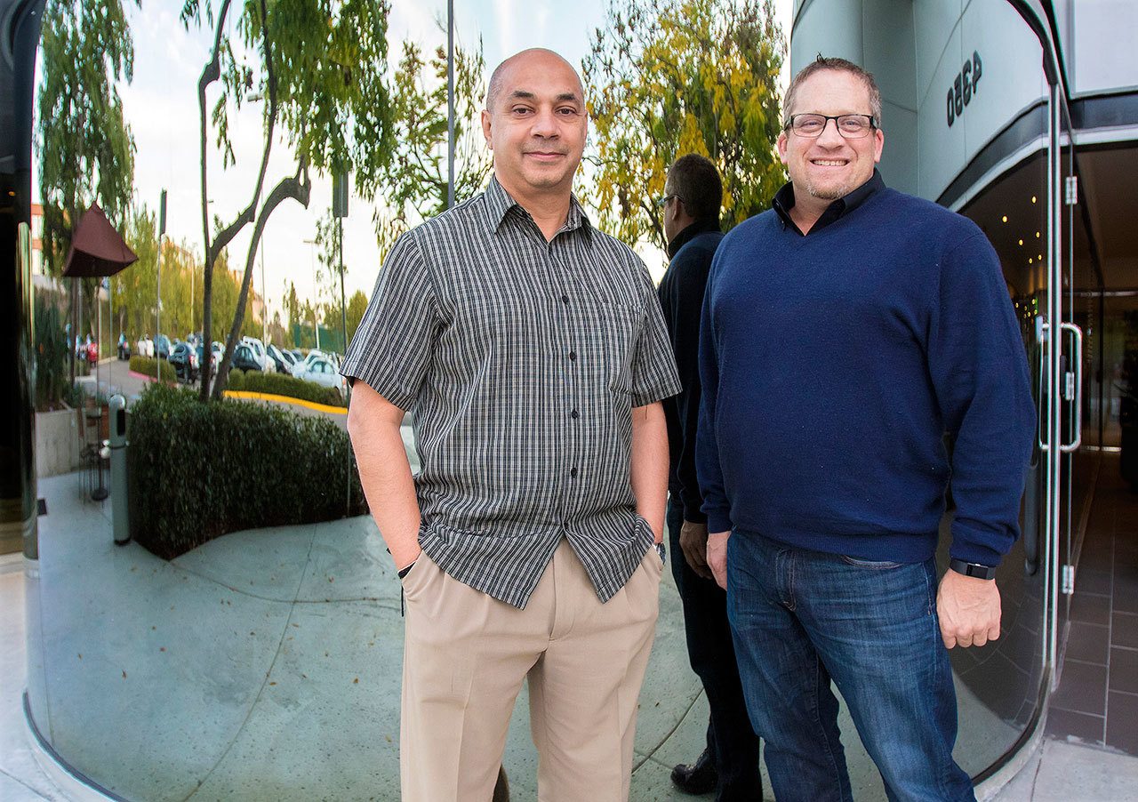 Sandeep Pandya, left, president of Netradyne, stands with Adam Kahn, vice president for fleets. Their company specializes in artificial intelligence for commercial vehicle fleets. (Don Boomer / Union-Tribune)