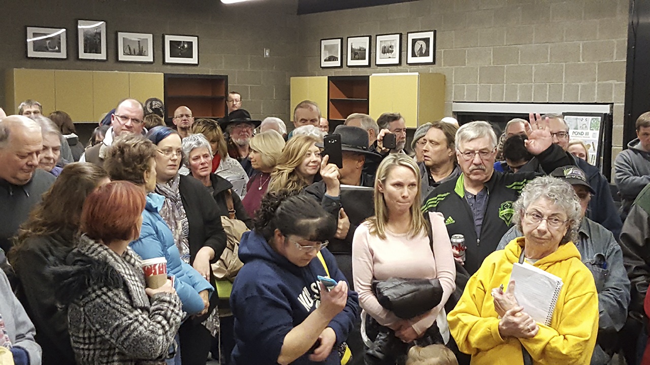 Neighbors from the Maltby area react with frustration and disbelief at the prospect of a 360-unit apartment complex proposed on rural Paradise Lake Road. The Dec. 14 meeting at the Brightwater Center was arranged by The Wolff Co., which is seeking permits from Snohomish County to build the project. (Noah Haglund / The Herald)