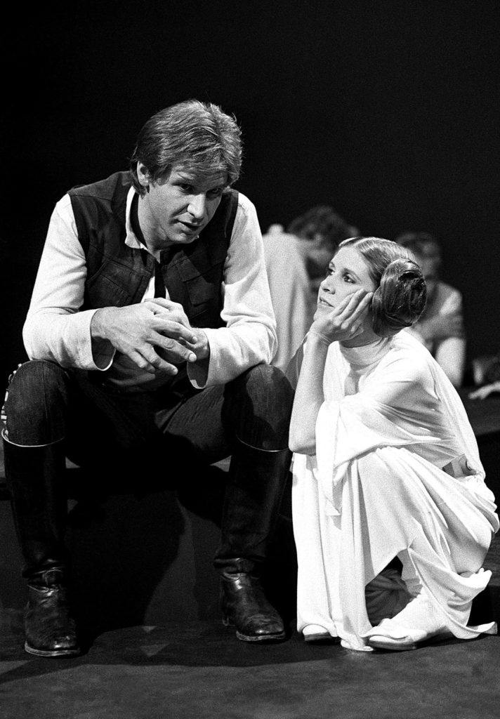 FILE – In this Nov. 13, 1978 file photo, Harrison Ford talks with Carrie Fisher during a break in the filming of the CBS-TV special “The Star Wars Holiday” in Los Angeles. On Tuesday, Dec. 27, 2016, a publicist says Fisher has died at the age of 60. (AP Photo/George Brich, File)
