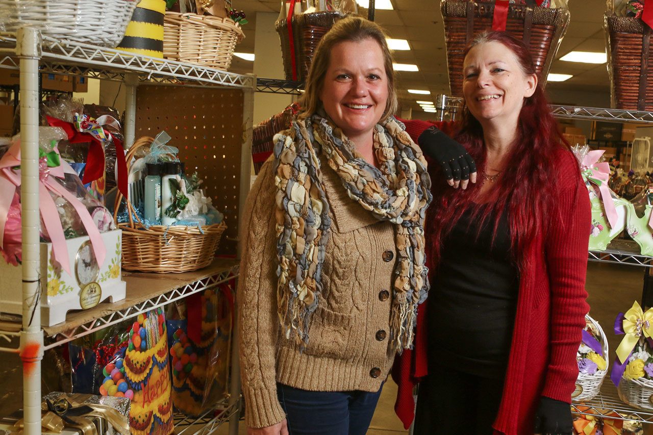 Anjanette Cozart, left, and Cindy Russell have worked together building a brand for more than 15 years. Cozart started the business more than 15 years ago out of her home and some of her clients include Amazon.com and Babies R Us. (Kevin Clark / The Herald)