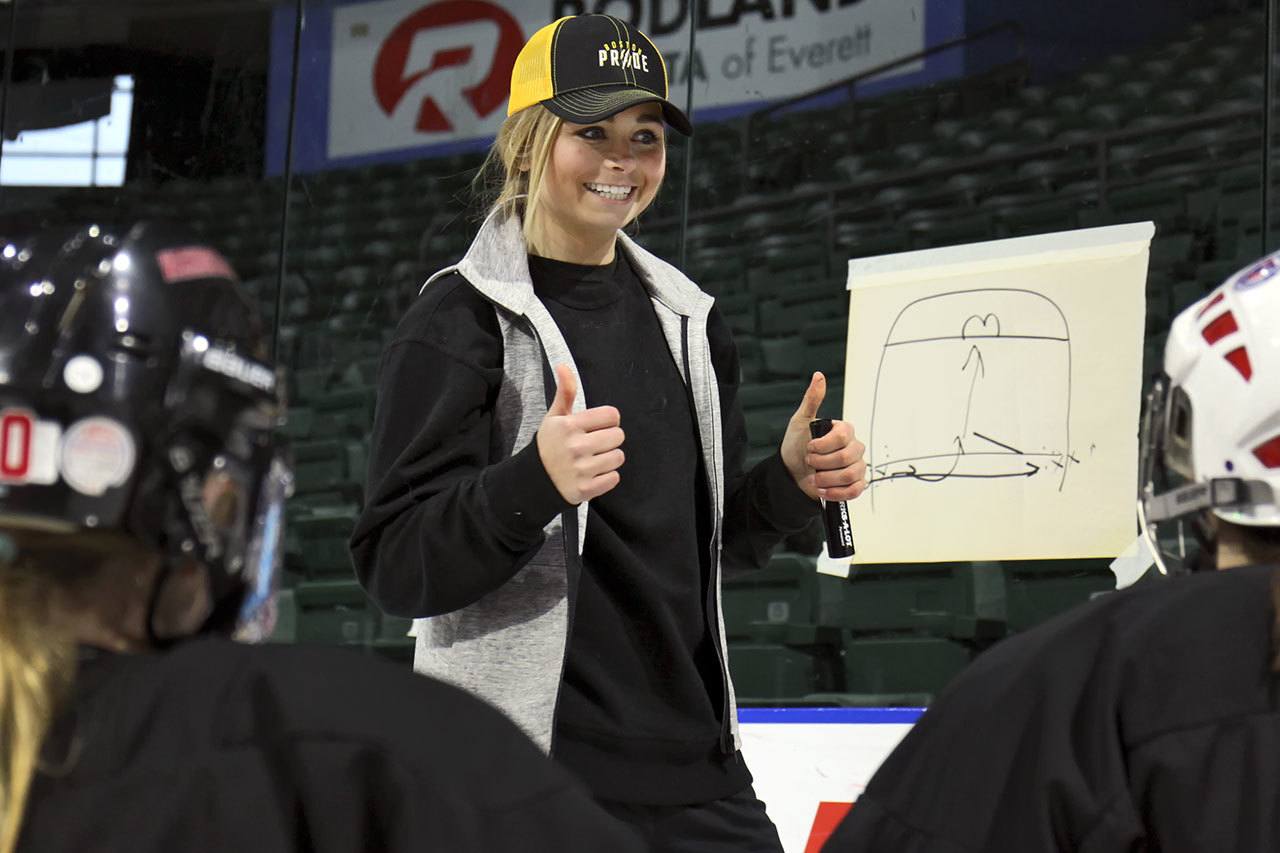 Lexi Bender looks for questions after giving instructions at a women’s hockey clinic she co-hosted Friday afternoon at Xfinity Arena in Everett. Bender, who is from Snohomish, is a professional hockey player with the Boston Pride of the National Women’s Hockey League. (Kevin Clark / The Herald)