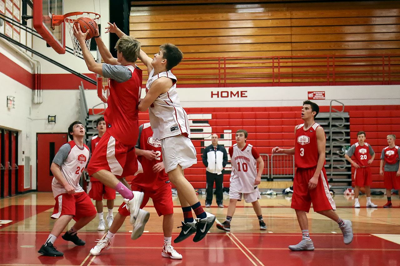 The Stanwood boys basketball team practices Friday morning in preparation for its tournament games in San Diego. (Kevin Clark / The Herald)