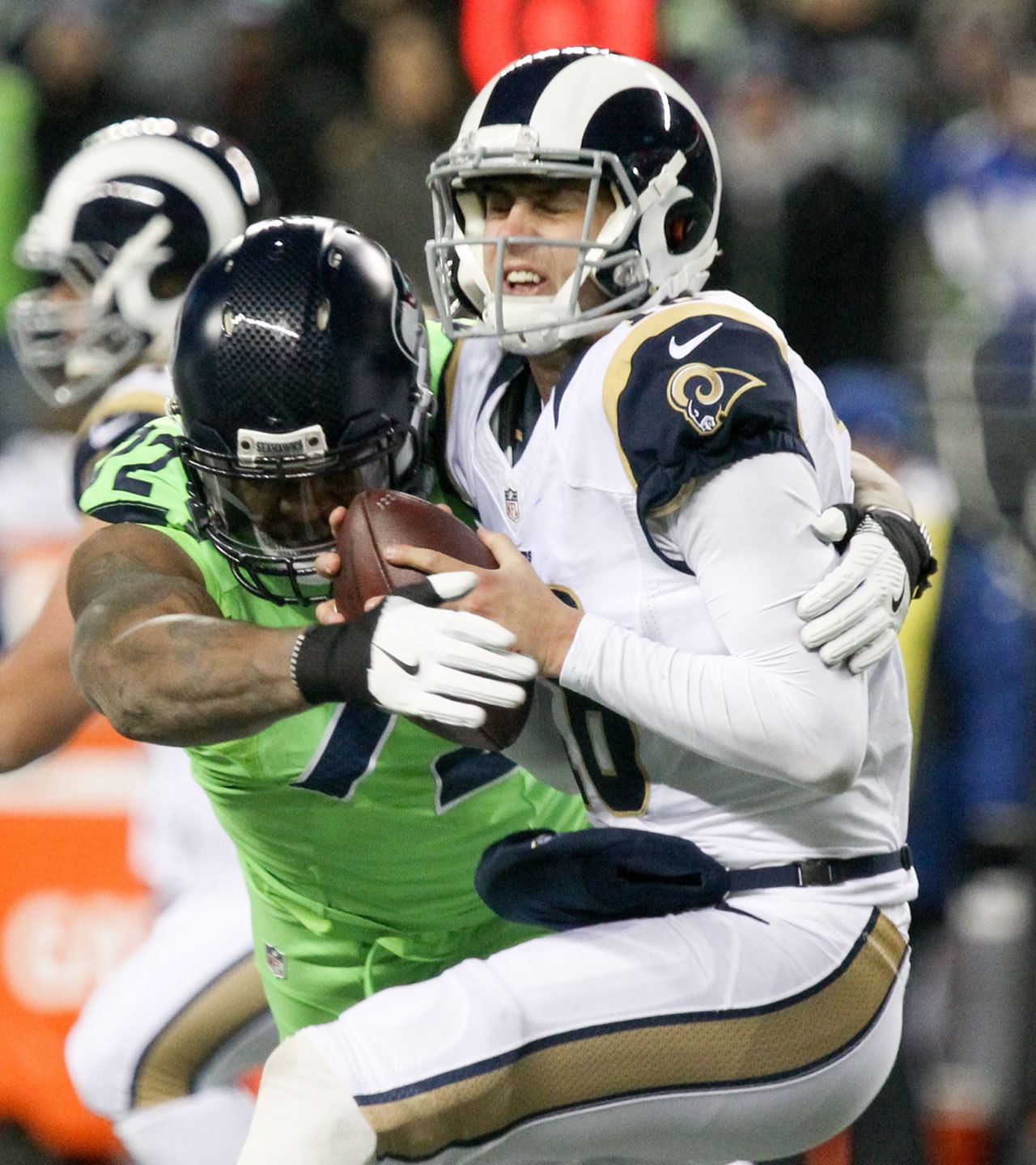 Seahawks defensive lineman Michael Bennett sacks Rams quarterback Jared Goff on Thursday at CenturyLink Field in Seattle. The Seahawks sacked Goff four times in the game. (Kevin Clark / The Herald)