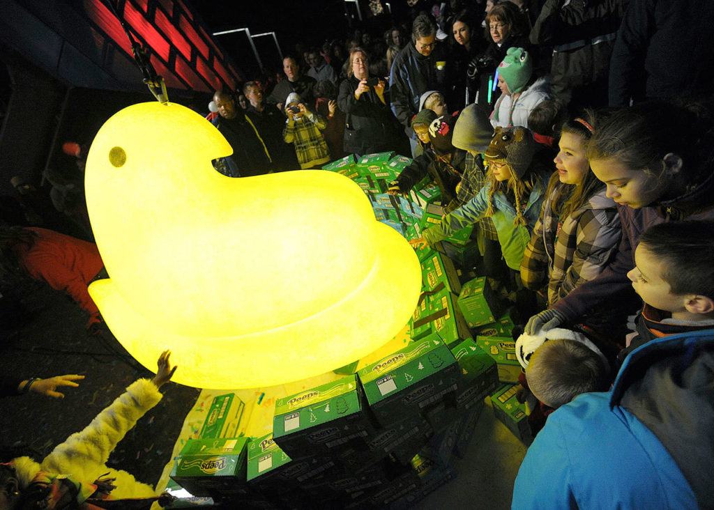 Children gather around a large Peep after it was dropped during a New Year’s Eve celebration, at the Levitt Pavillion on the Steelstacks Campus in Bethlehem, Pennsylvania, in 2011. It’s one of a number of ceremonies in which various objects are dropped around the country to welcome in the new year. (Matt Smith / The Express-Times) 
