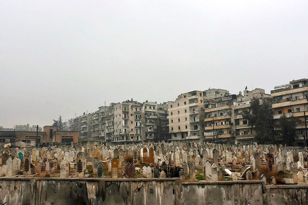 This photo, released by the Syrian official news agency SANA, shows a graveyard in east Aleppo, Syria, on Tuesday, Dec. 13. (SANA via AP)
