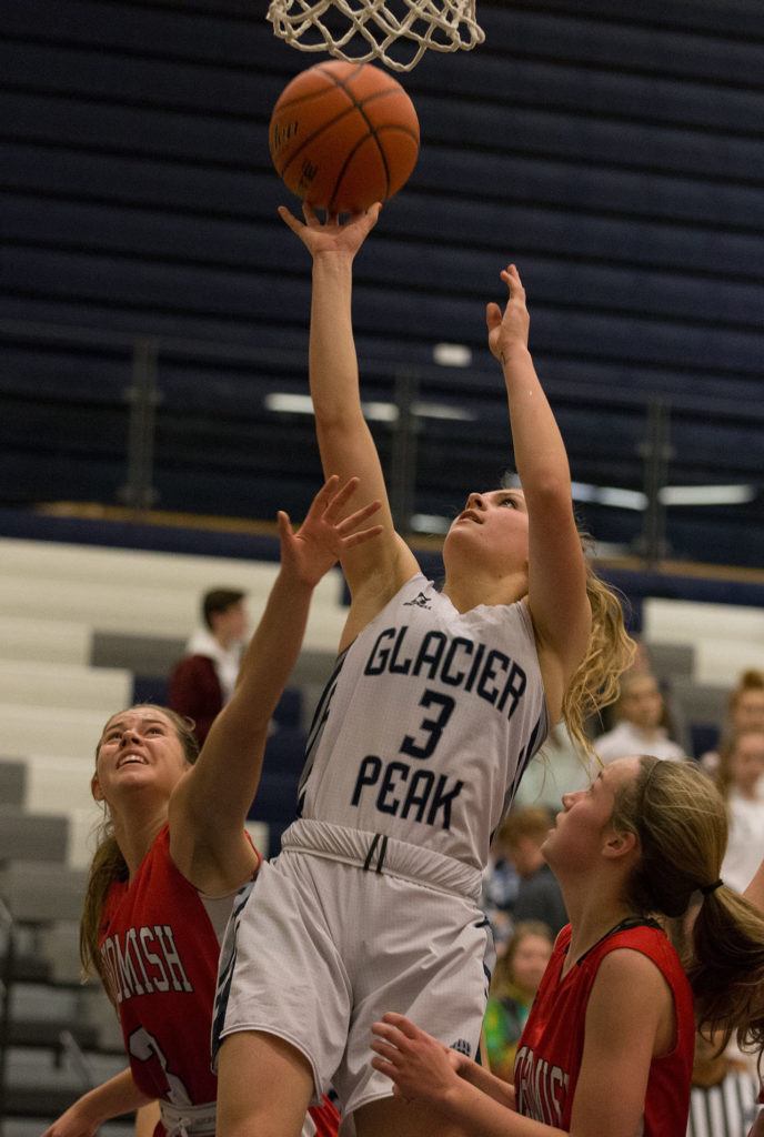 Glacier Peak’s Paisley Johnson drives for a layup during a game against Snohomish on Tuesday in Snohomish. (Andy Bronson / The Herald)
