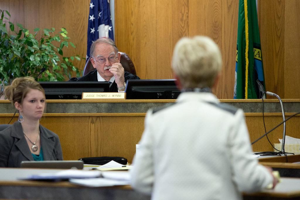 Wynne questions an attorney during court proceedings. (Andy Bronson / The Herald)
