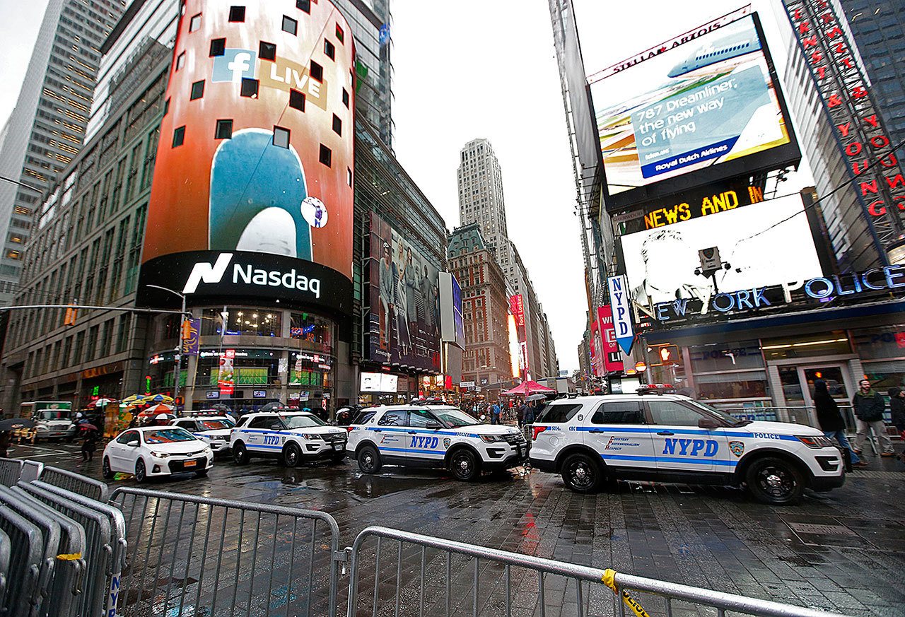 A row of New York City police cars is parked along a street in Times Square on Thursday, Dec. 29, in New York. The department is once again saying it is up to protecting the huge crowds that will gather in and around Times Square for New York City’s massive New Year’s Eve celebration. (AP Photo/Kathy Willens)