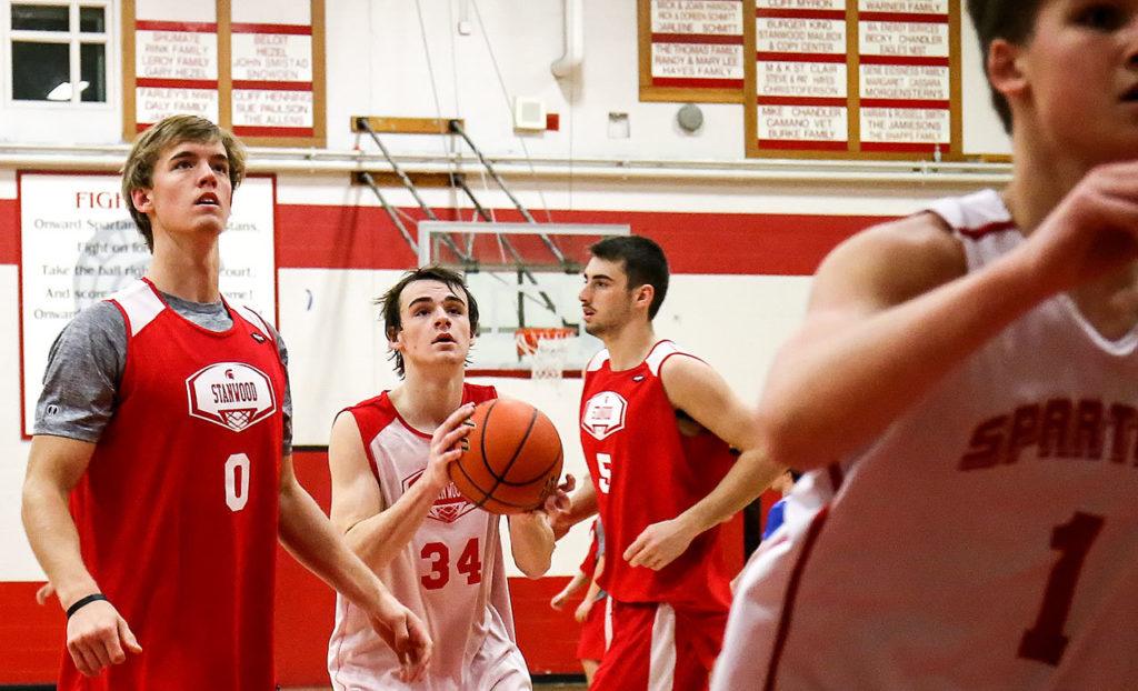 Members of the Stanwood basketball team practice Friday morning prior to traveling to San Diego to take part in a holiday tournament. (Kevin Clark / The Herald)
