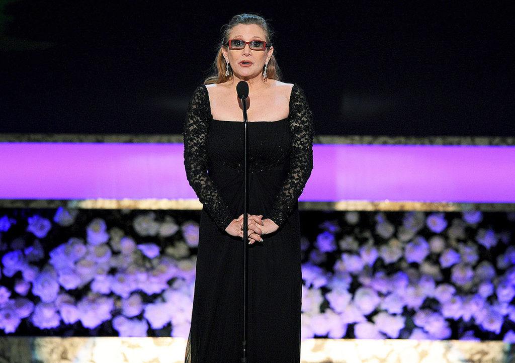 In this Jan. 25, 2015 photo, Carrie Fisher presents the life achievement award on stage at the 21st annual Screen Actors Guild Awards at the Shrine Auditorium in Los Angeles. (Photo by Vince Bucci/Invision/AP, File)
