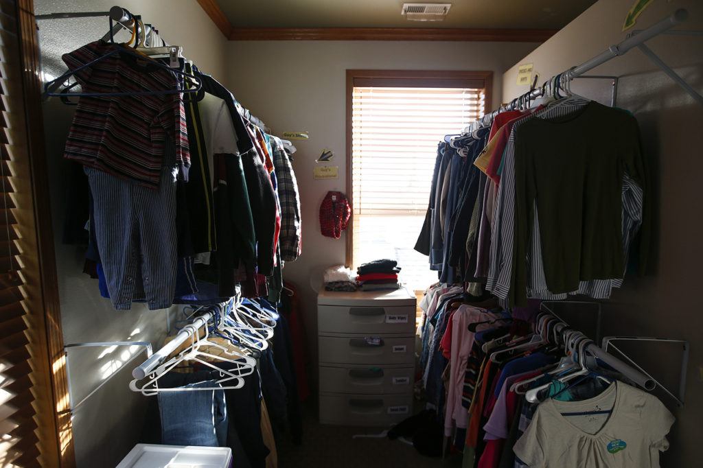 A clothing closet is seen at Cocoon House’s U-Turn drop-in center on Broadway in Everett. (Ian Terry / The Herald)
