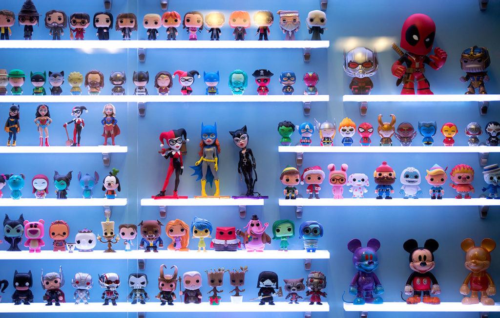 Collectibles ranging from Marvel’s Deadpool to Disney’s Mickey Mouse, line a case in Funko’s lobby. (Andy Bronson / The Herald)
