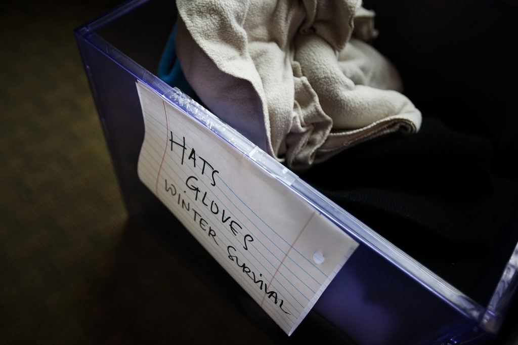 A bin full of winter clothing sits in a clothing closet at Cocoon House’s U-Turn drop-in center on Broadway in Everett on Tuesday, Dec. 13. (Ian Terry / The Herald)
