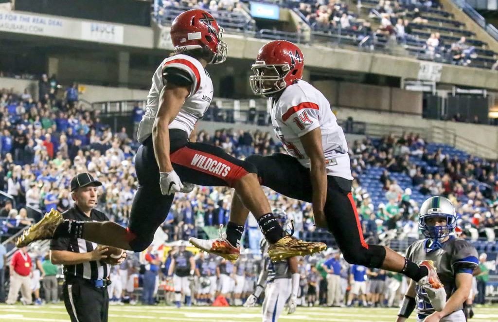Archbishop Murphy’s Kyler Gordon (left) and Anfernee Gurley celebrate a touchdown during the 2A state championship game against Liberty on Saturday at the Tacoma Dome. Archbishop Murphy defeated Liberty 56-14. (Kevin Clark / The Herald)
