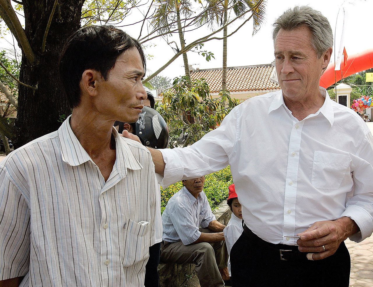 My Lai Massacre survivor Do Ba, 48 (left) stands with former U.S. Army officer Lawrence Colburn, 58, who rescued him during the March 16, 1968 My Lai massacre, during the 40th anniversary of the incident in My Lai, Quang Ngai Province, Vietnam, in 2008. (Chitose Suzuki / Associated Press)