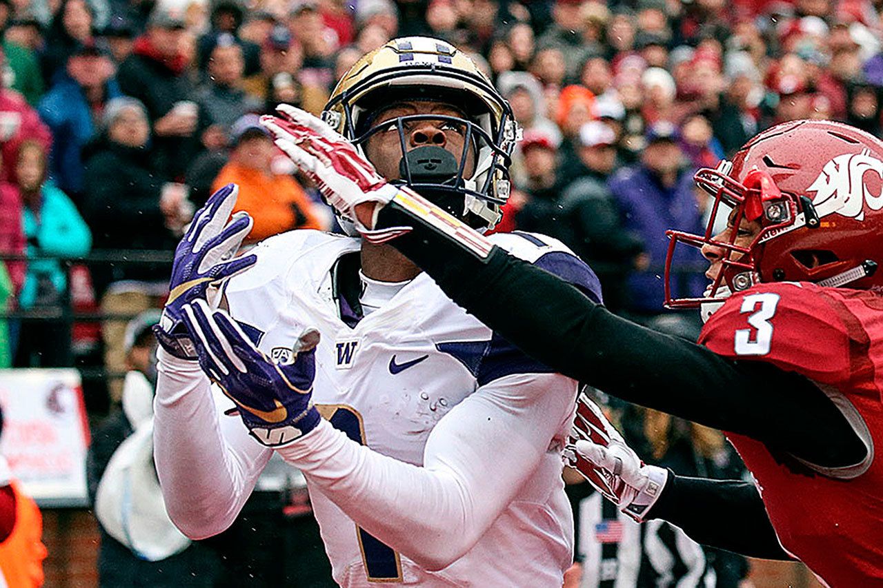 Washington wide receiver John Ross makes a touchdown catch over Washington State’s Darrien Molton during the Apple Cup on Nov. 25. Ross has 16 touchdown receptions this season. (Kevin Clark / The Herald)