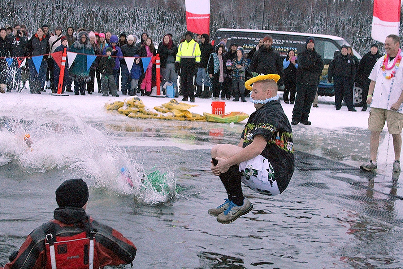 Baptism by ice: Alaskans make annual plunge into frigid lake