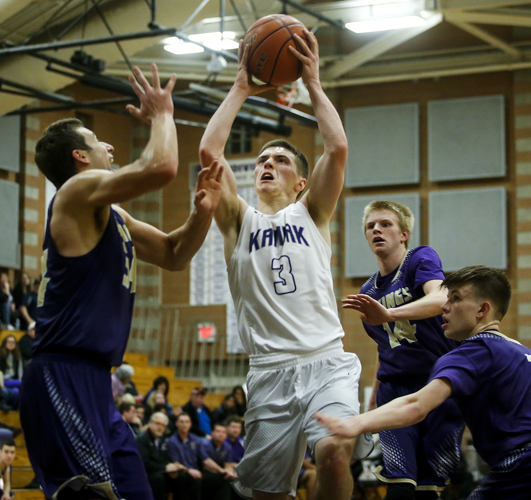 Kamiak’s Carson Tuttle (3) weaves through Lake Stevens defenders during a game Tuesday in Mukilteo. (Ian Terry / The Herald)