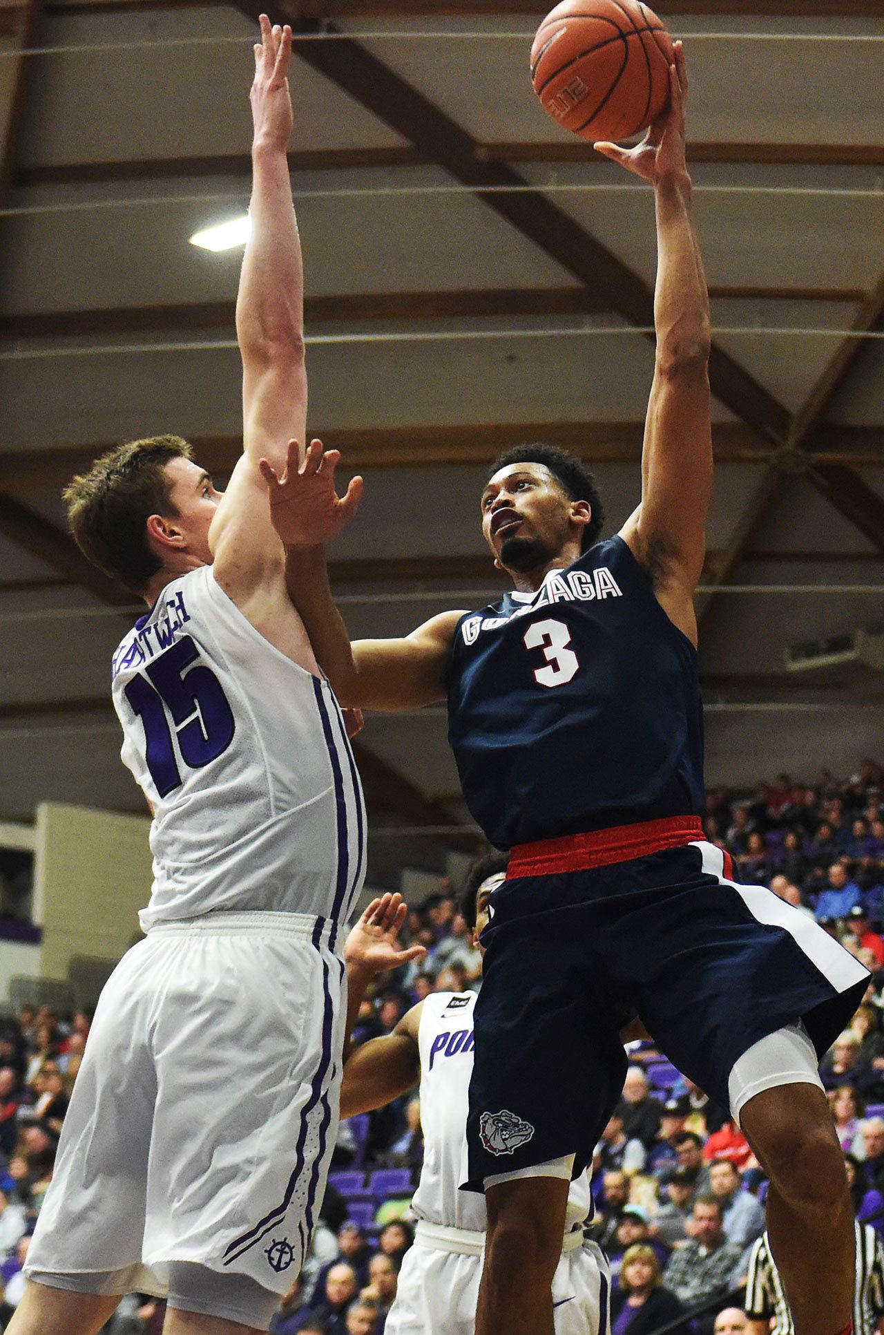 Gonzaga forward Johnathan Williams puts up a shot over Portland center Philipp Hartwich during the second half of Monday’s game. (AP Photo/Steve Dykes)