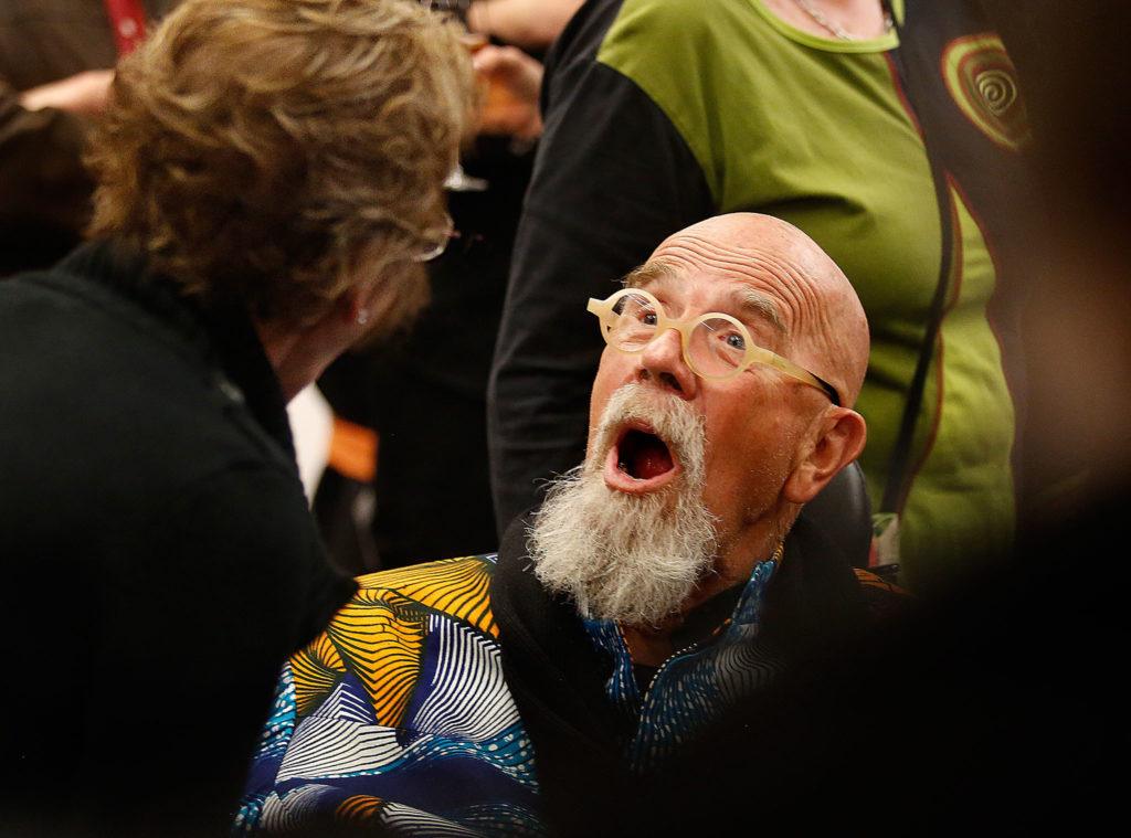 During the reception for him at Shack, Chuck Close is surprised by a visit from Margo Monteiro of San Diego, who went to grade school through high school with him. (Dan Bates / The Herald)
