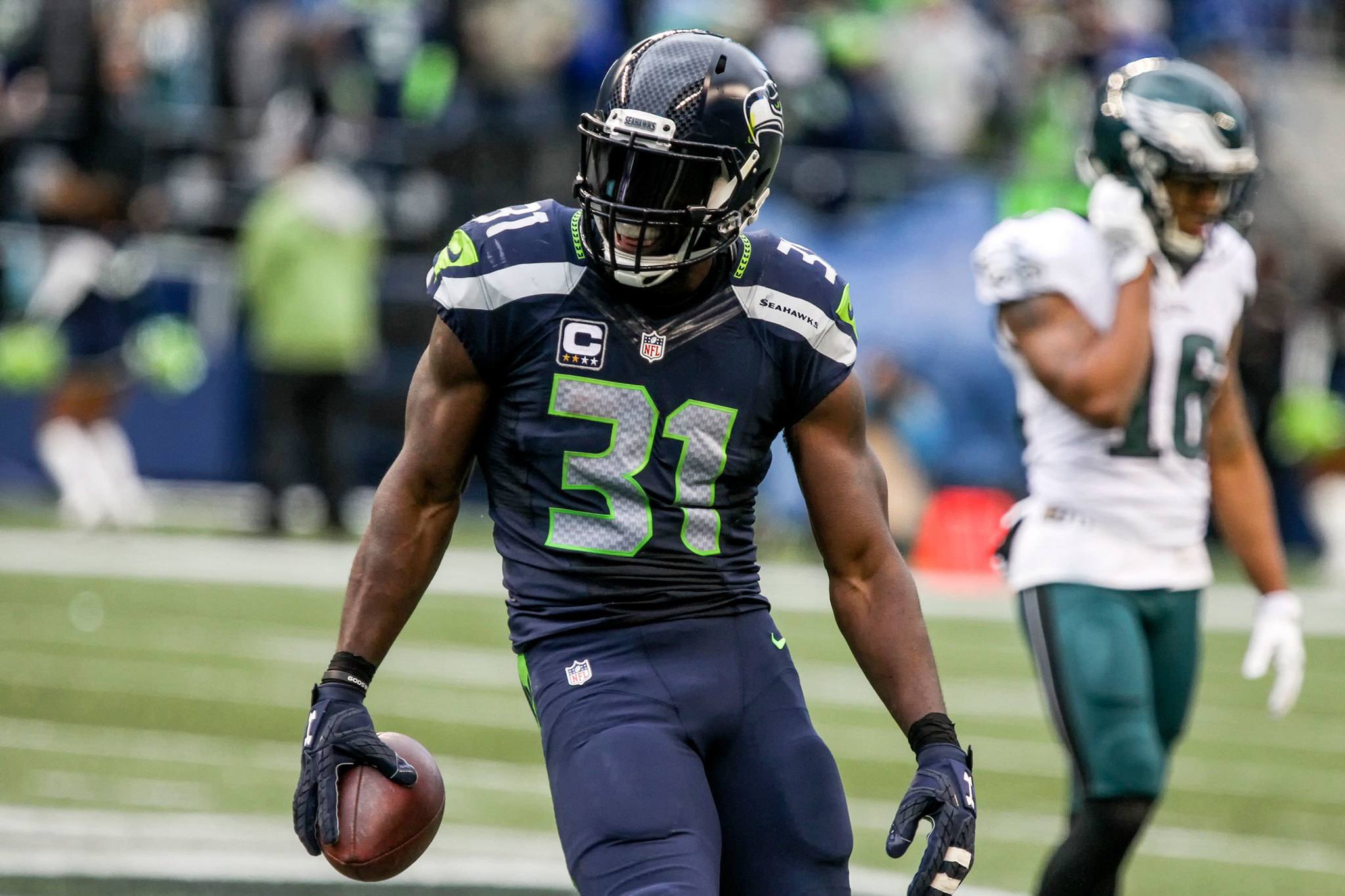 Seahawks safety Kam Chancellor celebrates his intereception with Eagles wide receiver Bryce Treggs making his way back to the bench during a game Nov. 20 at CenturyLink Field in Seattle. The Seahawks won 26-15. (Kevin Clark / The Herald)